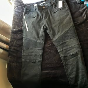 Embellish Black jeans with textured leg styling.
